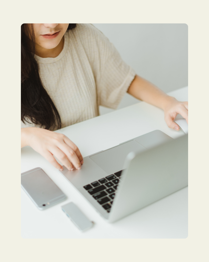 Digital marketing strategist working on a clarity-driven growth strategy at a clean workspace